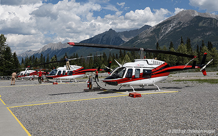 Bell 206L LongRanger | C-FSKR | untitled (Alpine Helicopters)  |  With a thunderstorm arriving, rotorblades need to be protected | CANMORE MUNICIPAL HELIPORT (----/---) 17.07.2023