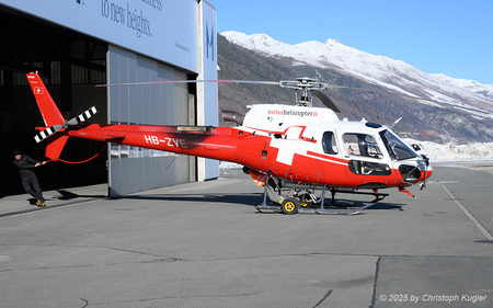 Airbus Helicopters H125 Ecureuil | HB-ZVE | Swiss Helicopters  |  This Airbus Helicopters H125 Ecureuil has completed its mission for the day and is now being towed back into the hangar for the night.  | SAMEDAN (LSZS/SMV) 27.12.2025